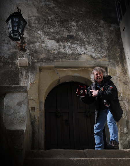 Posing with Dracula Book in Front of Dracula's Door
